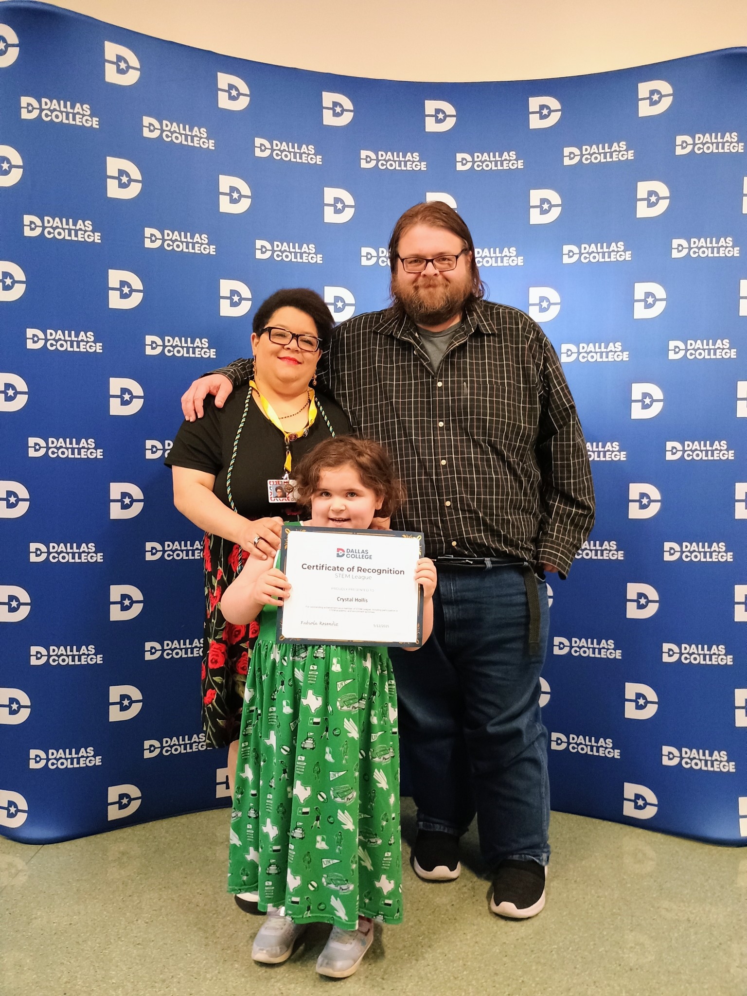 Crystal with family at Dallas College ceremony